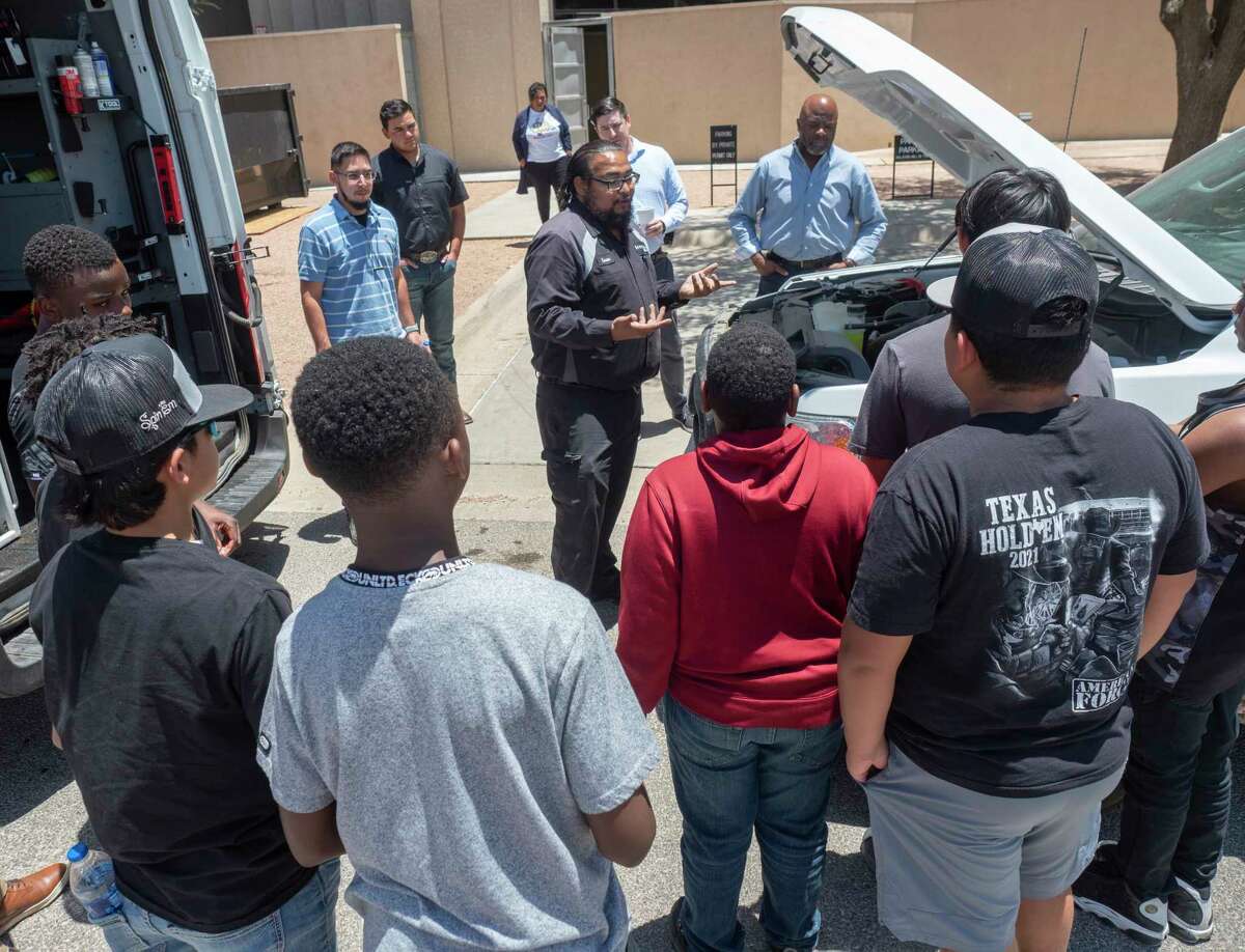 Students from Opportunity Tribe learn basic car maintenance from Sewell Ford mobile technicians 06/21/2022 at Diamondback Energy summer STEM Camp at their Fasken Center offices. Tim Fischer/Reporter-Telegram