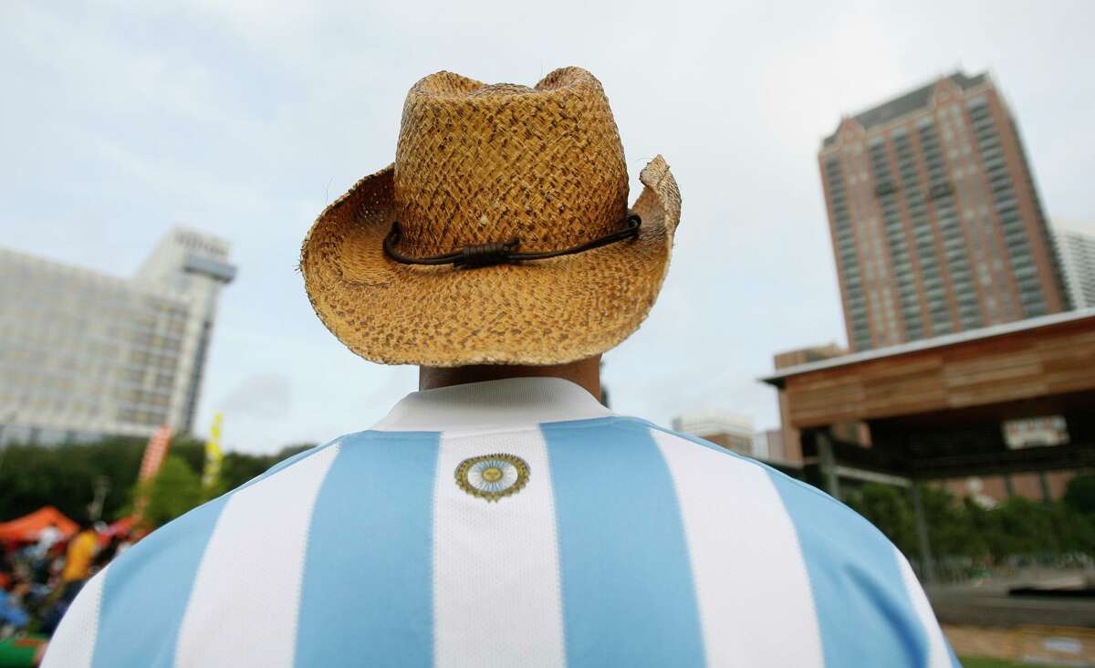 Jason Caballo, 28, of Argentina, is seen in a crowd of mostly Mexican supporters as he wears Argentina's jersey at Discovery Green Park during a World Cup kick-off party hosted by the Houston Dynamo on Friday, June 11, 2010, in Houston.