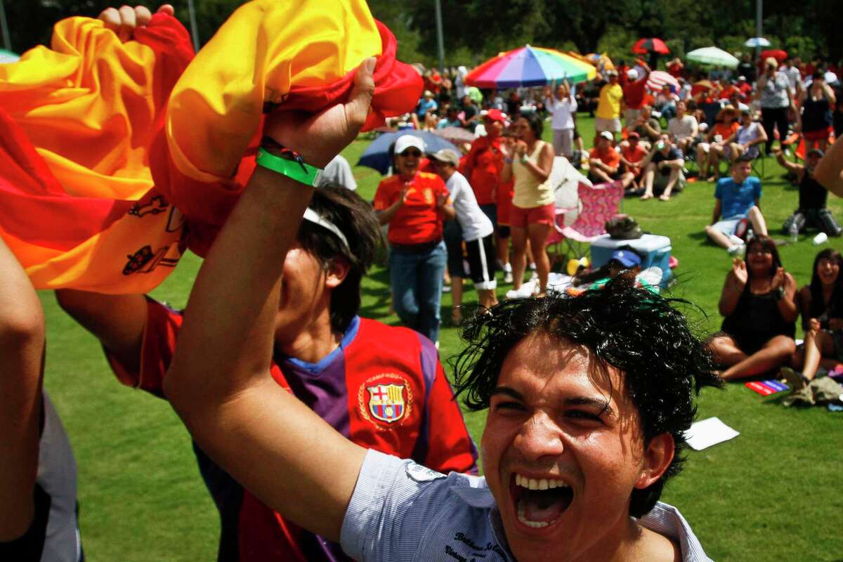 Franko Suazo and other soccer fans react to a goal made by Andres Iniesta in the 116th minute during a World Cup Soccer watch party at Discovery Green Sunday, July 11, 2010, in Houston. Spain went on to defeat the Netherlands 1-0 for its first World Cup title.