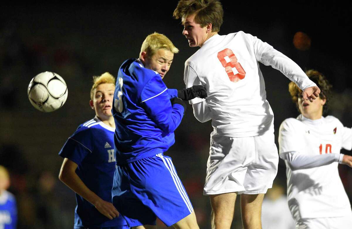 Hall’s Ted Monnes (3) and Greenwich’s Josh Frumin (8) battle for the ball in the first half of a CIAC Class LL Boys Soccer State Championship at Veterans Memorial Stadium on Nov. 23, 2019 in New Britain, Conn. The two programs will meet again in the FCIAC-CCC Kick Off Classic this September.