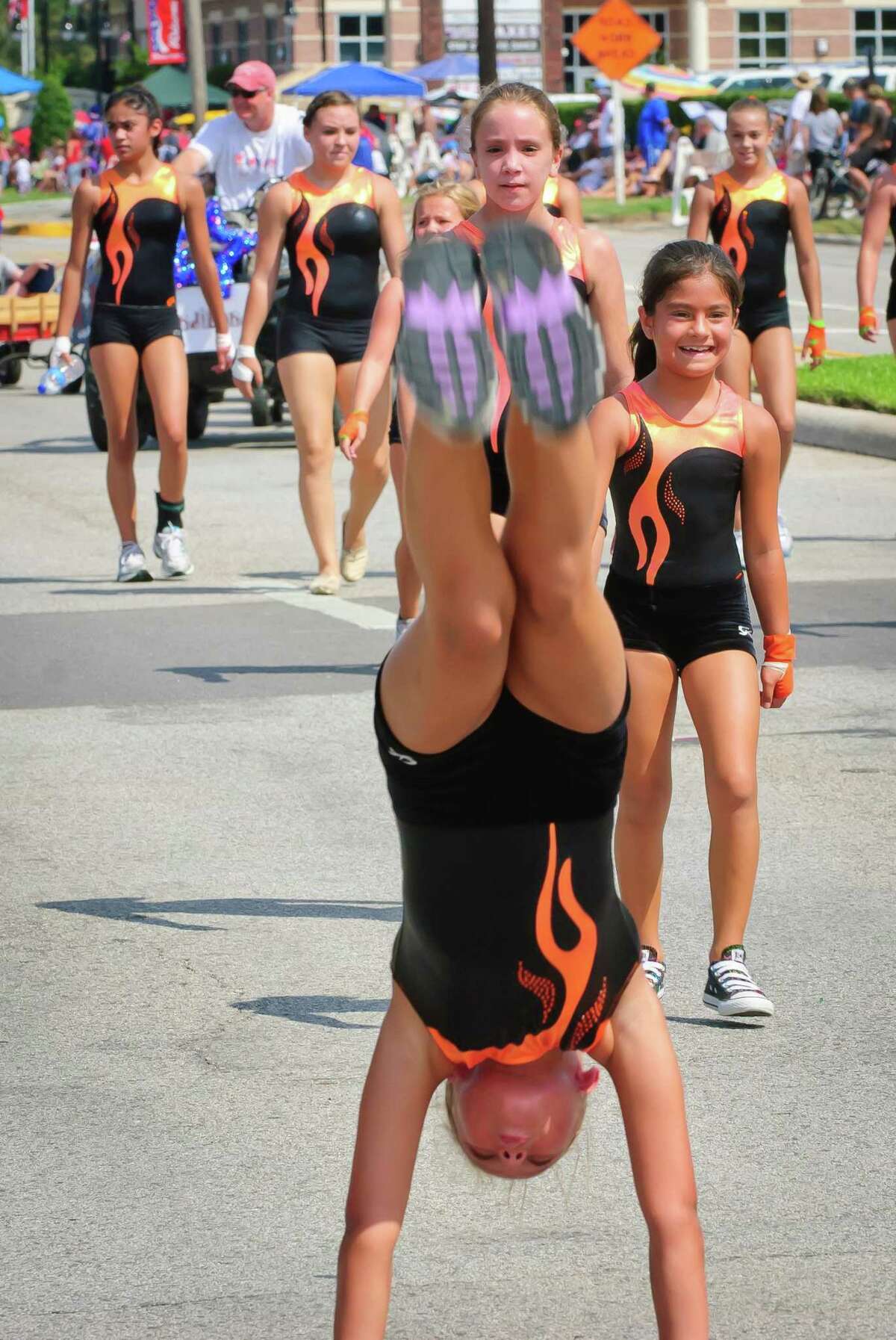 Members of a gymnastic team show their stuff during the 2011 Friendswood Fourth of July parade. The longtime parade will start at 10 a.m. July 4.