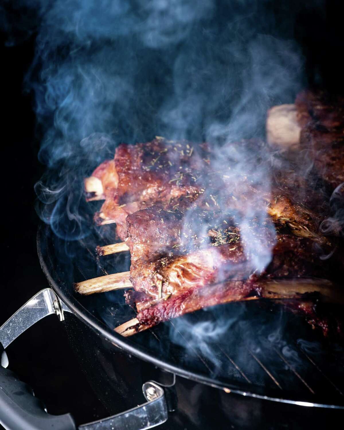 If your smoke looks this dark, your meat is ruined. You need to clean your pit and work on getting better airflow.