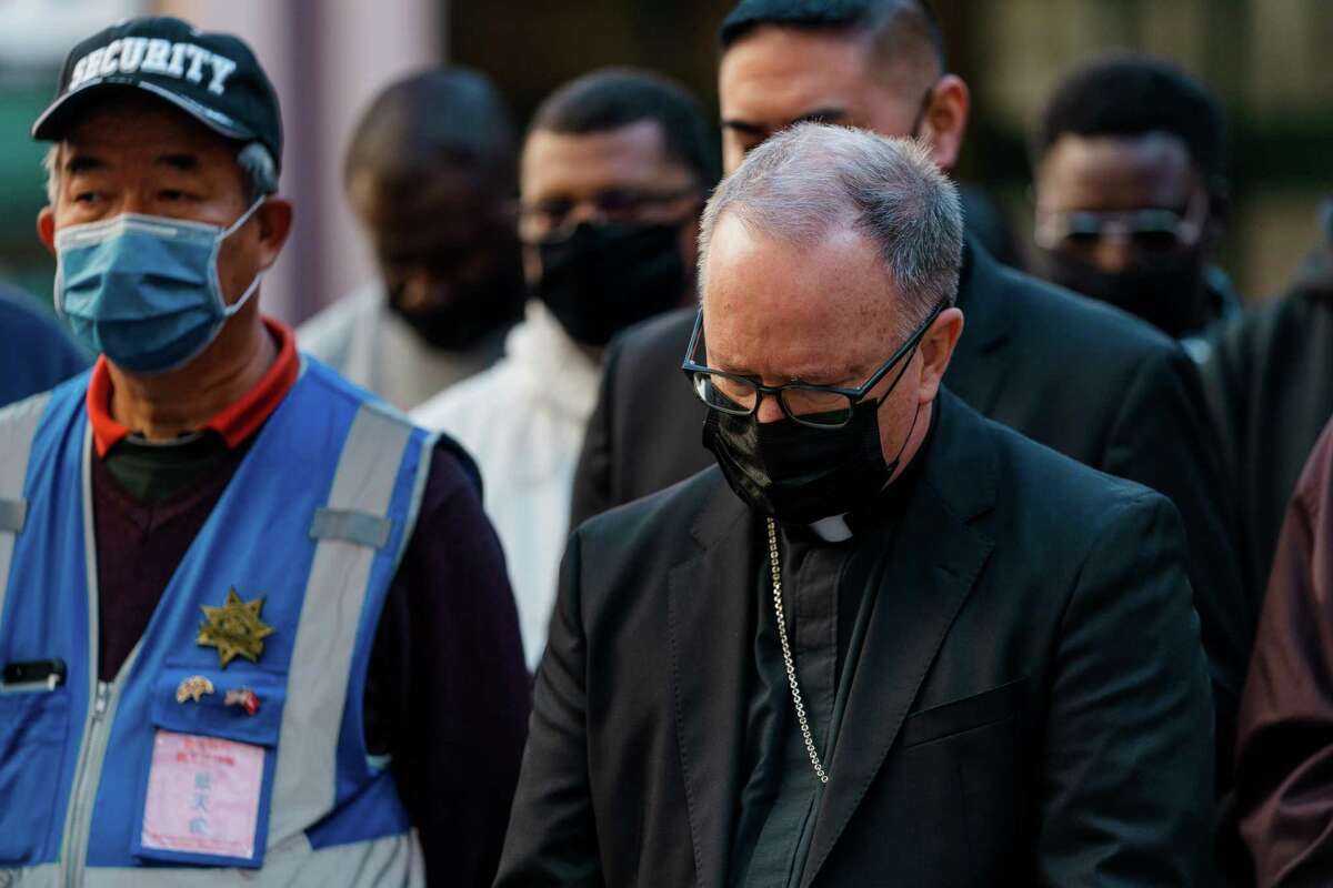 Oakland Bishop Michael C. Barber prays along with other community members at a press conference in Oakland on Dec. 7, 2021. The Supreme Court on Tuesday rejected a challenge by the Oakland bishop to a California law expanding the statute of limitations for child victims of sexual abuse.