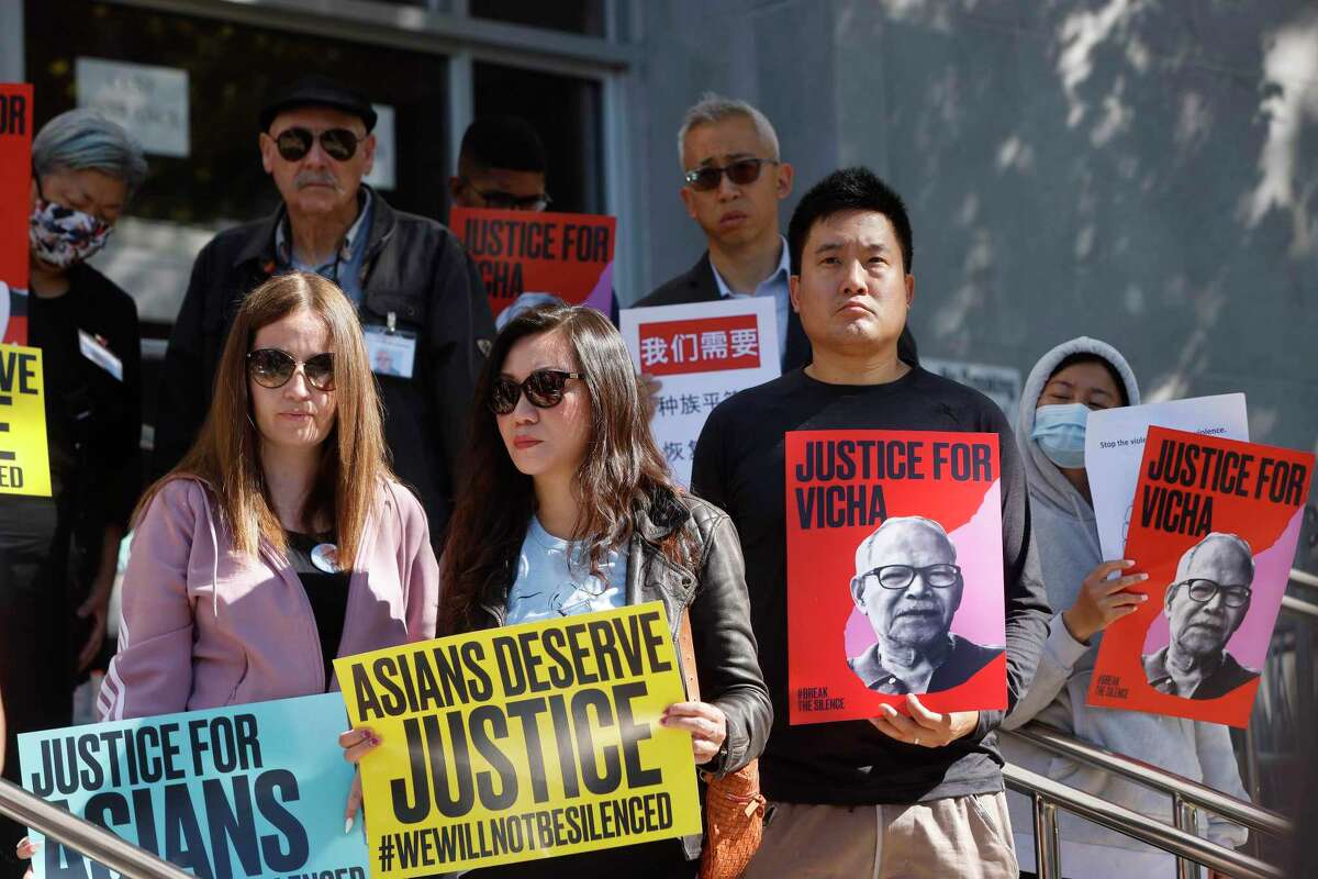 Demonstrators hold signs during a rally on June 14 demanding justice for Vicha Ratanapakdee, who died after being assaulted in San Francisco in January 2021.