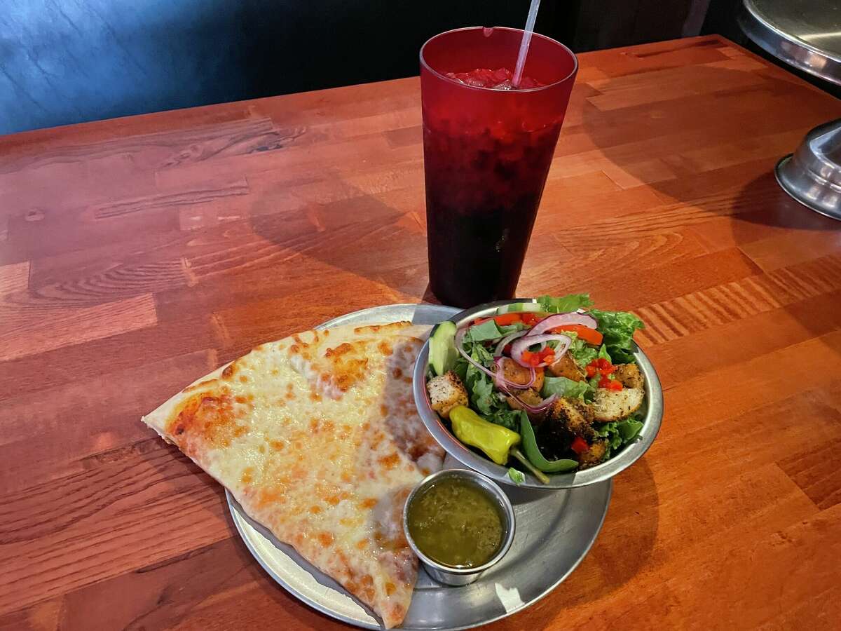 The slice and salad at Loop & Lil's tastes better than it looks, and the red cup filled with Coke was a nice touch.