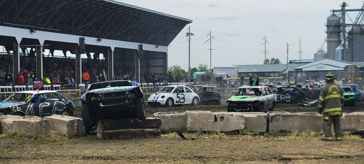 Drivers compete May 21 in the Gut N’ Go Compact classes during a demolition derby at the Western Illinois Fairgrounds. The Western Illinois Fair, which begins today at the fairgrounds, is known for its School Bus Demolition Derby.