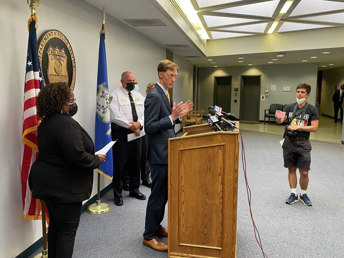 Mayor Justin Elicker speaks Tuesday at a news conference about the case of Richard Cox, who may have been paralyzed during a ride in the rear of a police van. Behind him are acting Chief Regina Rush-Kittle, left, and Assistant Chief Karl Jacobson