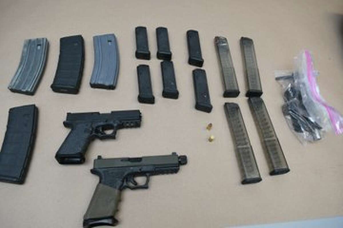 Guns, ammo seized from Madison Avenue after police said man fired shot through floor.  