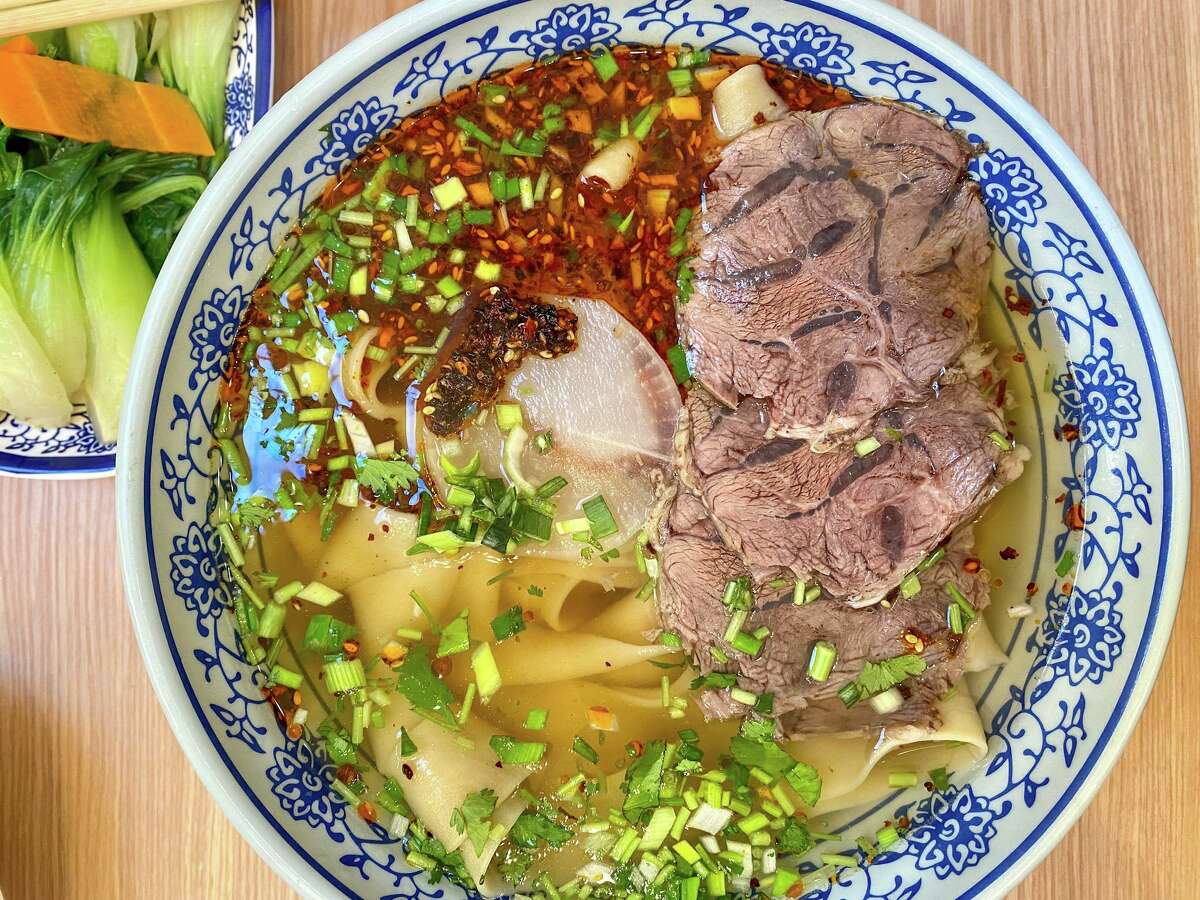 Lanzhou beef noodle soup with large, flat hand-pulled noodles at Ox 9 in San Mateo.