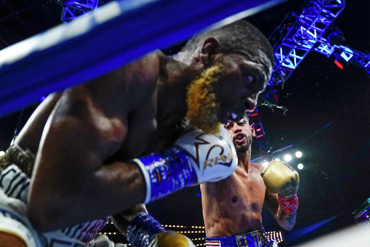 Cuba's Robeisy Ramirez, right, punches Abraham Nova during the fifth round of a featherweight boxing bout Saturday, June 18, 2022, in New York. Ramirez won in the fifth round. (AP Photo/Frank Franklin II)