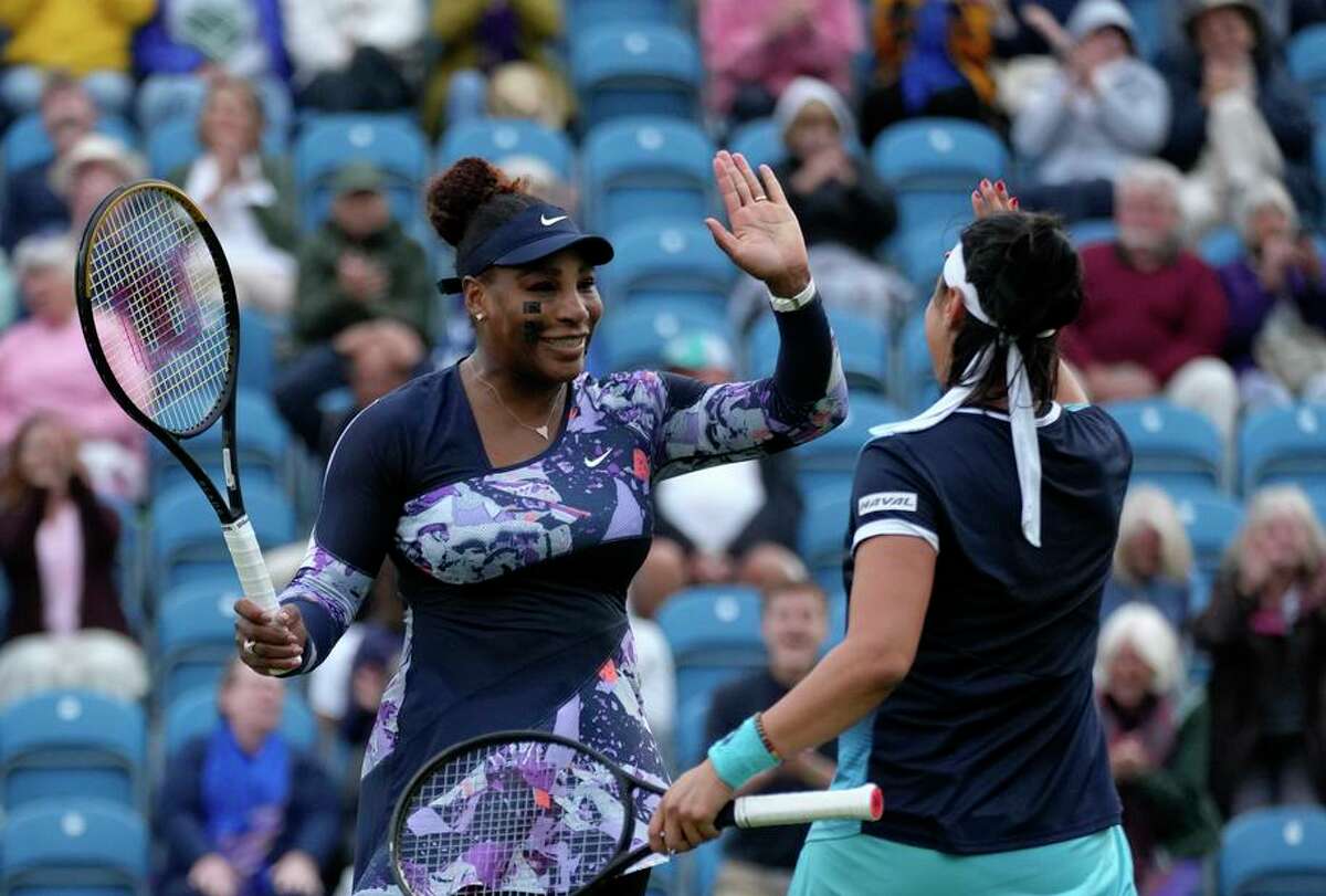 Serena Williams and doubles partner Ons Jabeur celebrate after winning in Williams’ first competitive match in a year.