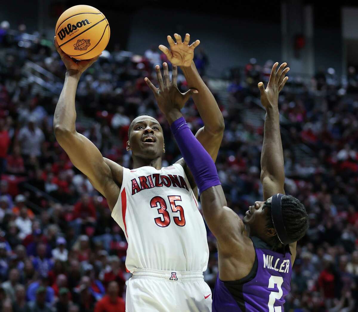 SAN DIEGO, CALIFORNIA - MARCH 20: Christian Koloko #35 of the Arizona Wildcats shoots the ball against Emanuel Miller #2 of the TCU Horned Frogs during the second half in the second round game of the 2022 NCAA Men's Basketball Tournament at Viejas Arena at San Diego State University on March 20, 2022 in San Diego, California. (Photo by Sean M. Haffey/Getty Images)