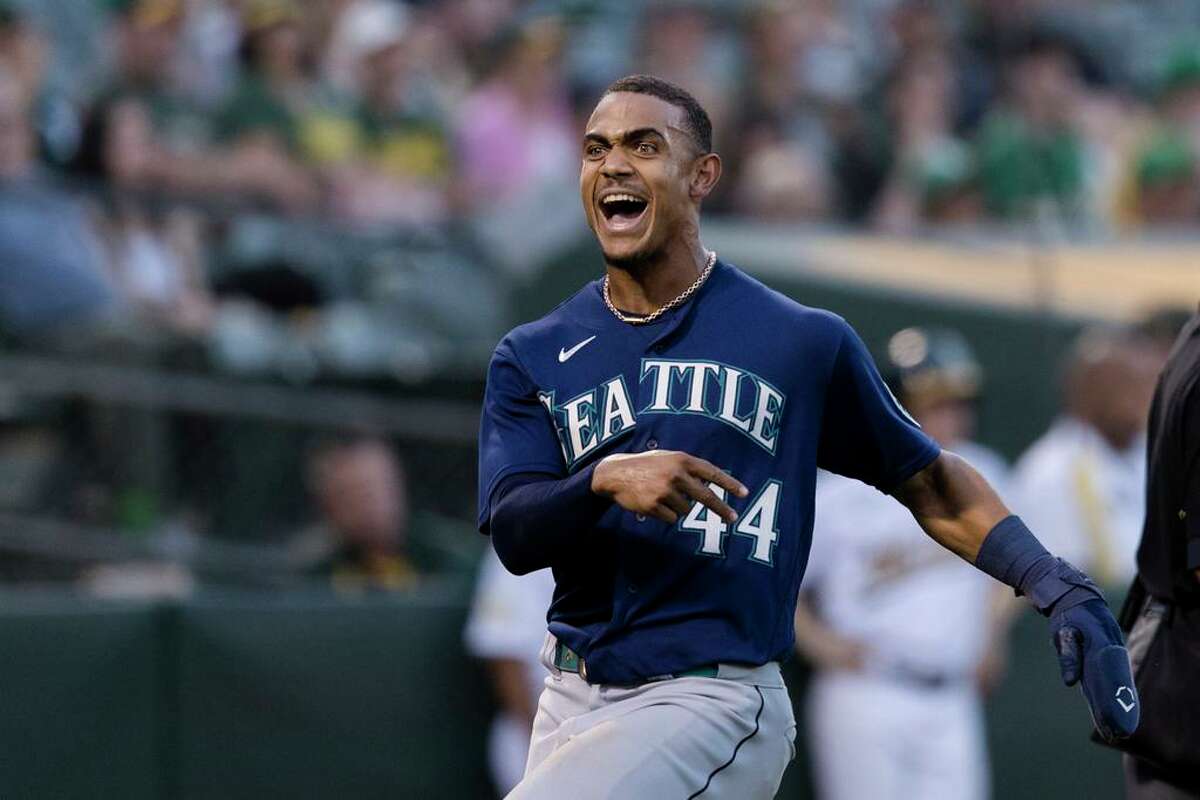 Seattle Mariners' Julio Rodriguez reacts after scoring a run against the Oakland Athletics during the sixth inning of a baseball game in Oakland, Calif., Tuesday, June 21, 2022. (AP Photo/John Hefti)