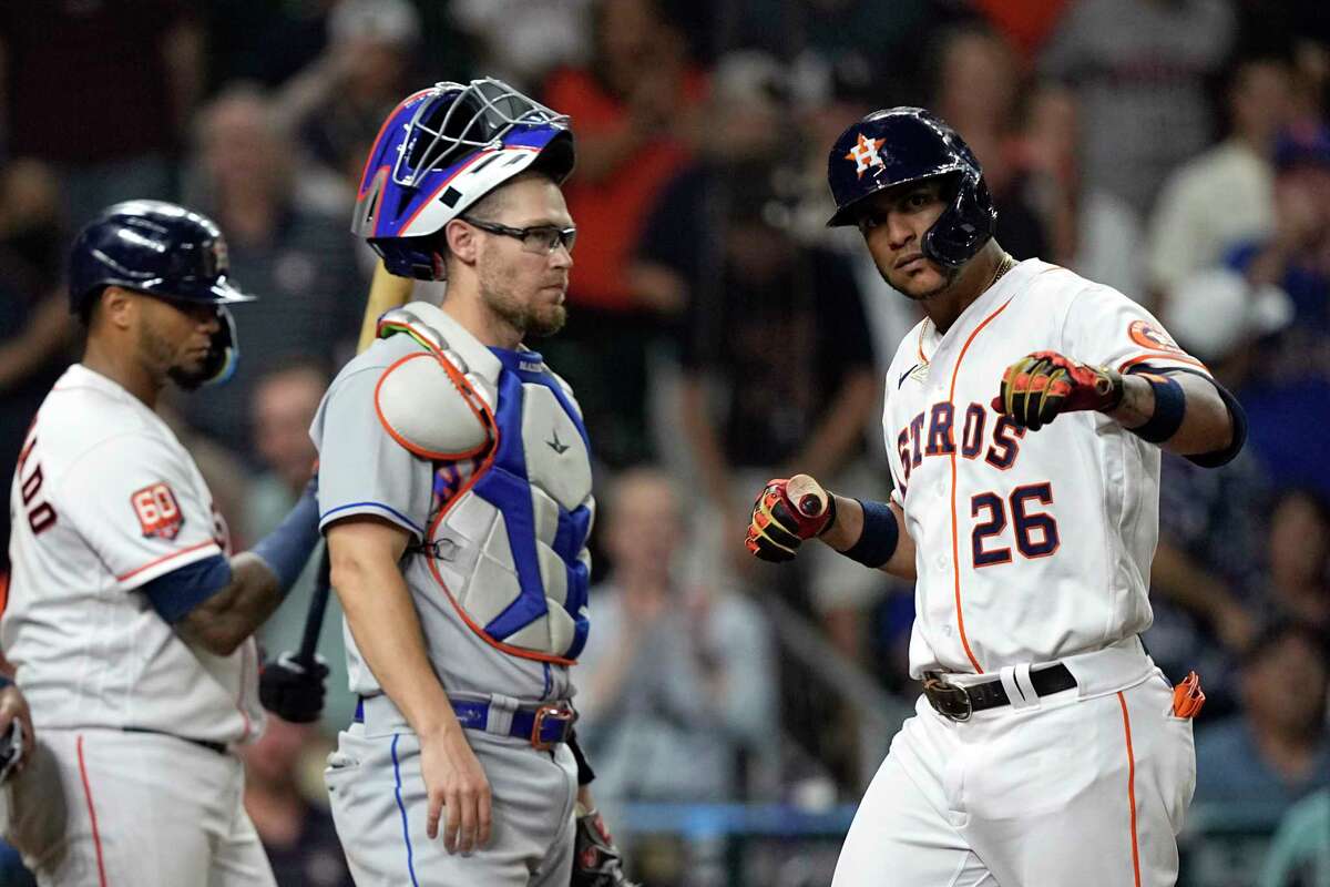 Houston Astros' Jose Siri (26) celebrates after hitting a home run as New York Mets catcher Patrick Mazeika watches during the eighth inning of a baseball game Tuesday, June 21, 2022, in Houston. (AP Photo/David J. Phillip)