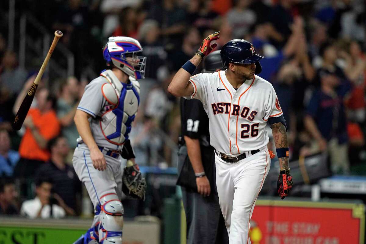 Houston Astros' Jose Siri (26) flips his bat after hitting a home run as New York Mets catcher Patrick Mazeika watches during the eighth inning of a baseball game Tuesday, June 21, 2022, in Houston. (AP Photo/David J. Phillip)