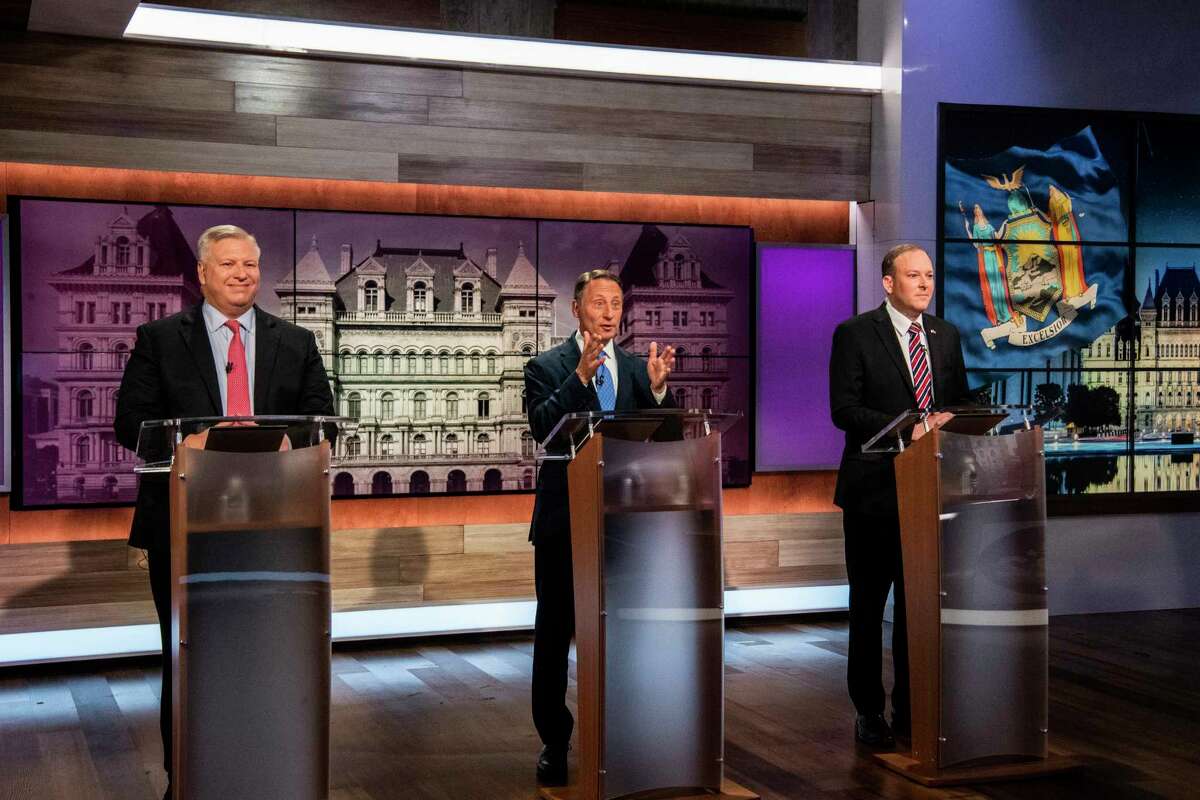 From left to right, businessman Harry Wilson, former Westchester County Executive Rob Astorino and Lee Zeldin face off during New York's Republican gubernatorial debate at the studios of Spectrum News NY1 on Monday, June 20, 2022, in New York. (Brittainy Newman/Newsday via AP, Pool)