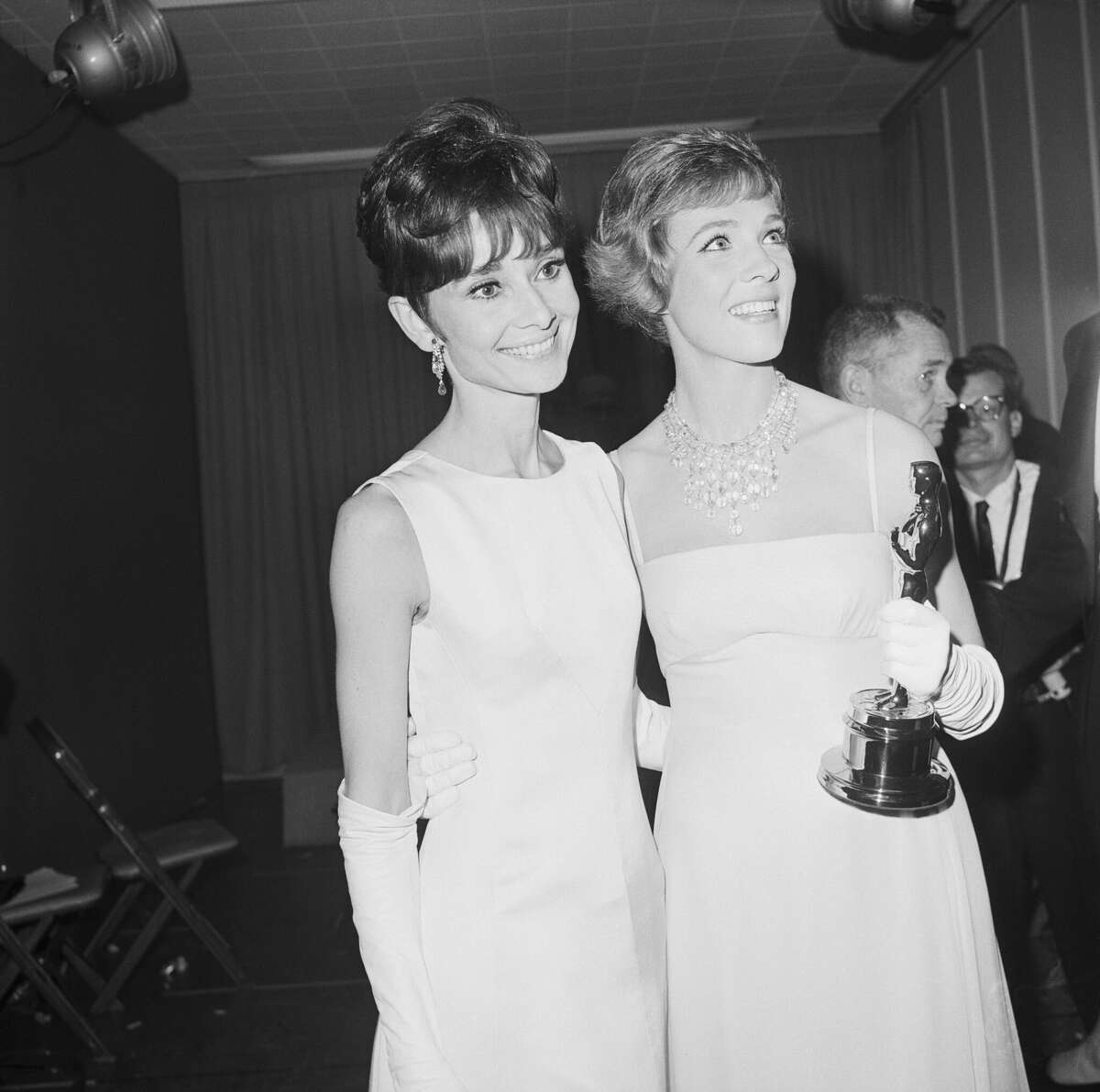 Julie Andrews was passed over, in favor of Audrey Hepburn, for the role of Eliza Dolittle in My Fair Lady, which she originated on stage. This freed her to play the title role in Mary Poppins, for which she won the Academy Award for Best Actress; Hepburn was not even nominated. Here the two of them stand after Andrews received her Oscar. 1965.