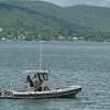 A patrol boat searches Candlewood Lake in Brookfield, Conn, for the body of Larry Kwokpo Chan on Thursday, June 9, 2022. His body was recovered by divers days later on June 16. The Office of the Chief Medical Examiner ruled the 24-year-old Bristol resident died from drowning, and the death has been ruled an accident.