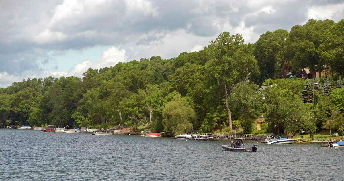 First responders searching Candlewood Lake in Brookfield, Conn. in June. A Danbury man was pronounced dead after he was rescued from the waters of Candlewood Lake Monday evening. First responders saw a bystander administering CPR near Button Island.