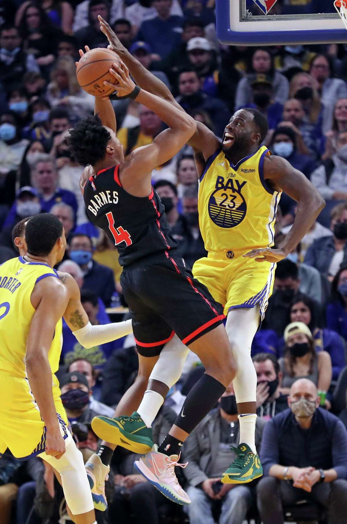 The Warriors’ Draymond Green defends Toronto’s Scottie Barnes in November. His strong play in the first half earned Green a spot in the All-Star Game, but back problems kept him out of more than 30 games in the middle of the season.