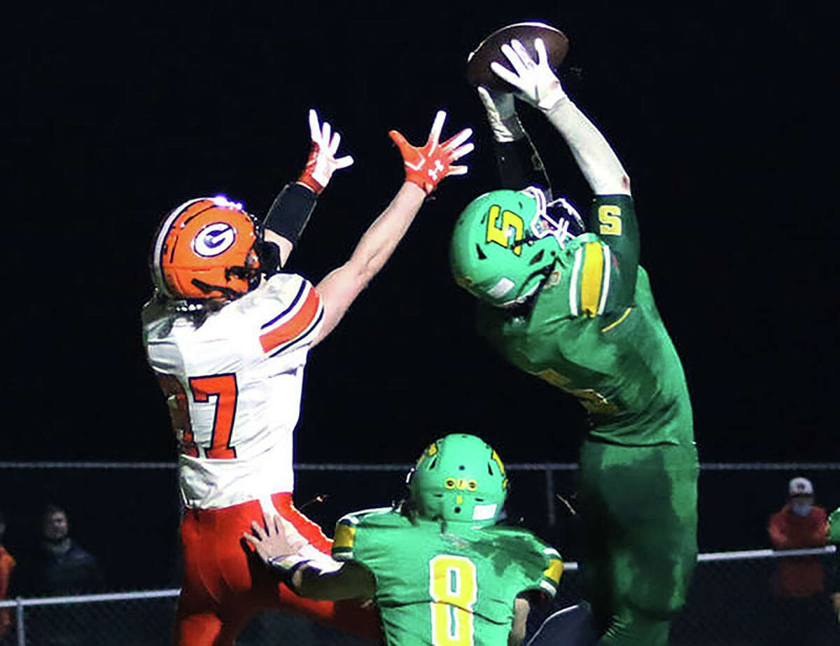 Soutwestern's Gavin Day, right, intercepts a pass against Gillespie last season. Day was named the winning Red All-Star team's Defensive MVP at  Saturday's 48th annual Shrine Game in Bloomington, while Jersey's Edwards Roberts was named Defensive MVP for the Blue All-Stars.