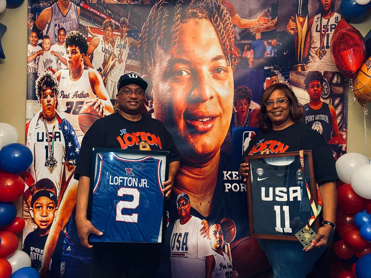 Kenneth Lofton Sr. and his wife Gina pose with memorabilia from their son, Kenneth Lofton Jr, who hopes to be drafted into the NBA on Thursday night. 
