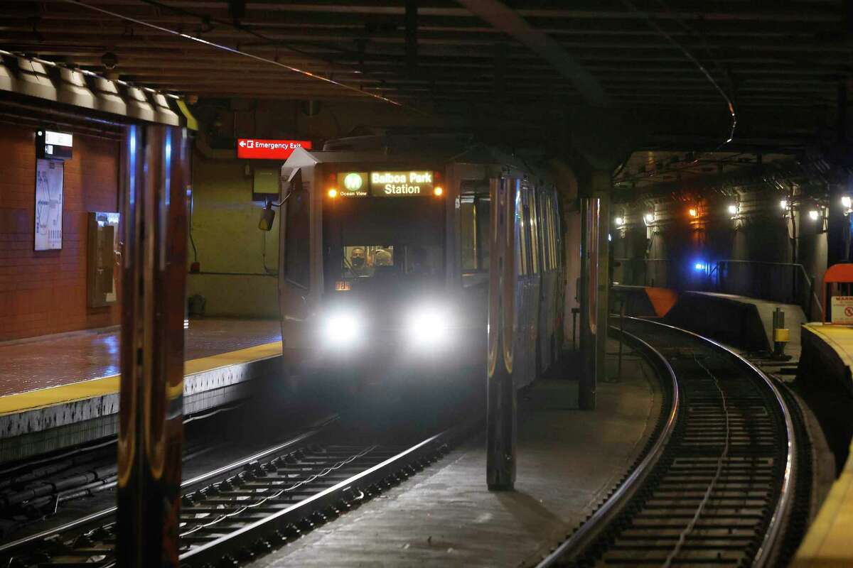 A Muni train arrives at Castro Street Station on Wednesday, where earlier that day a person was pronounced dead and another taken to a hospital after a shooting that occurred inside a Muni train en route from the Forest Hill Station. San Francisco police said they arrested a man suspected in the shooting.