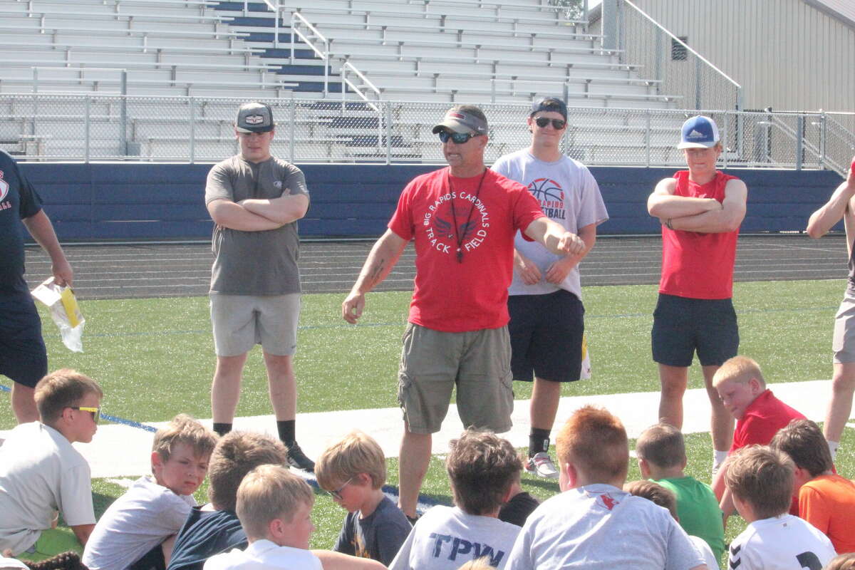 Big Rapids football coach Mike Selzer gives football players direction at Tuesday's youth camp