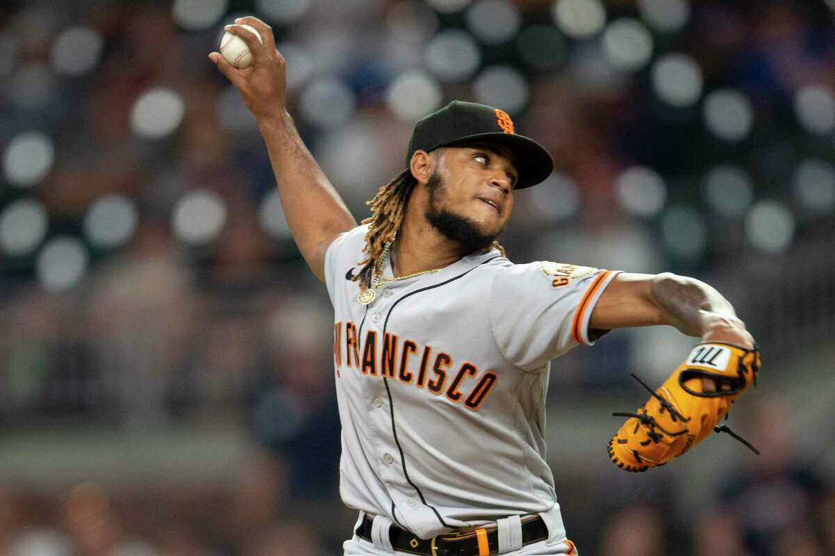 San Francisco Giants relief pitcher Camilo Doval working in the ninth inning of a baseball game against the Atlanta Braves Tuesday, June 21, 2022, in Atlanta. (AP Photo/Hakim Wright Sr.)
