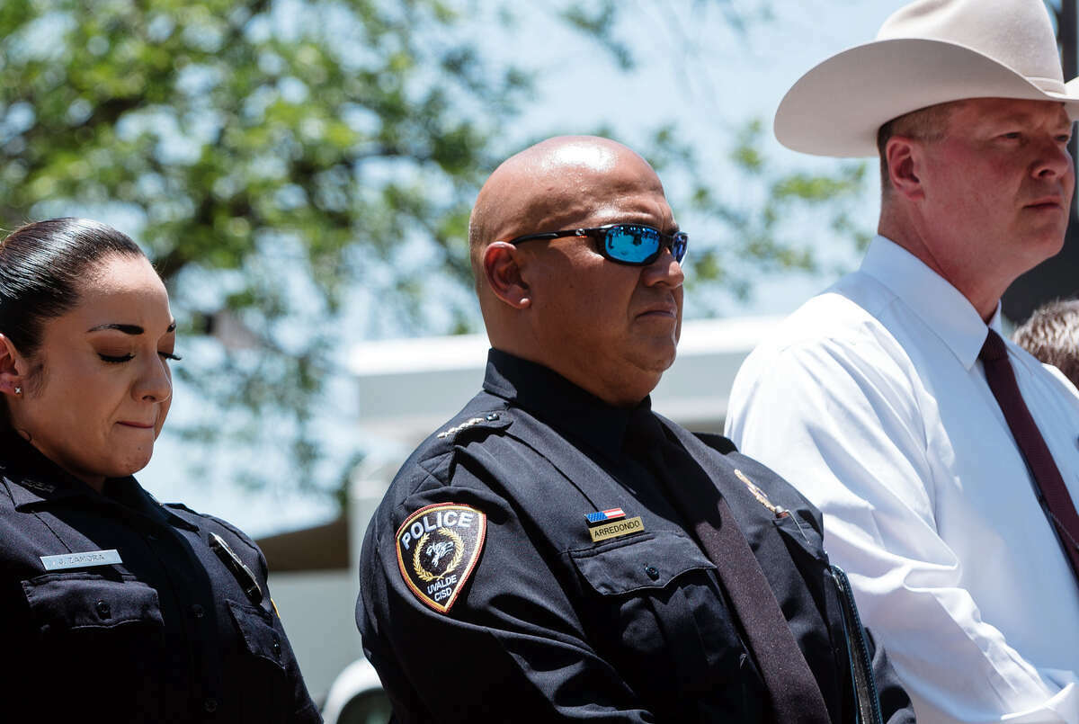Chief Pete Arredondo, second from right, at a news conference in Uvalde, Texas, on May 26, 2022. Arredondo, the commander at the scene of the mass shooting at Robb Elementary School, arrived without a police radio, and decided in the first minutes on an approach that would delay a confrontation. (Christopher Lee/The New York Times)