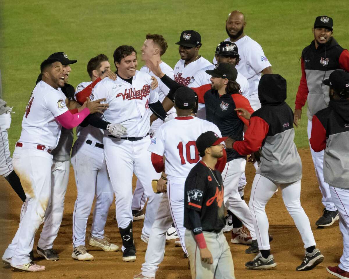 The Tri-City ValleyCats swarm first baseman Brad Zunica, center, after he hit a walk-off single to beat the Trois-Rivieres Aigles at Joseph L. Bruno Stadium on the Hudson Valley Community College campus in Troy, NY, on Wednesday, June 22, 2022. (Jim Franco/Special the Times Union)
