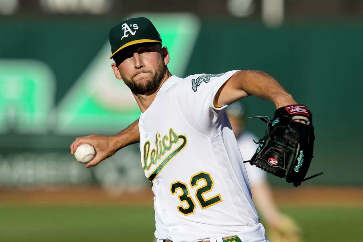Oakland Athletics' James Kaprielian pitches against the Seattle Mariners during the first inning of a baseball game in Oakland, Calif., Tuesday, June 21, 2022. (AP Photo/John Hefti)