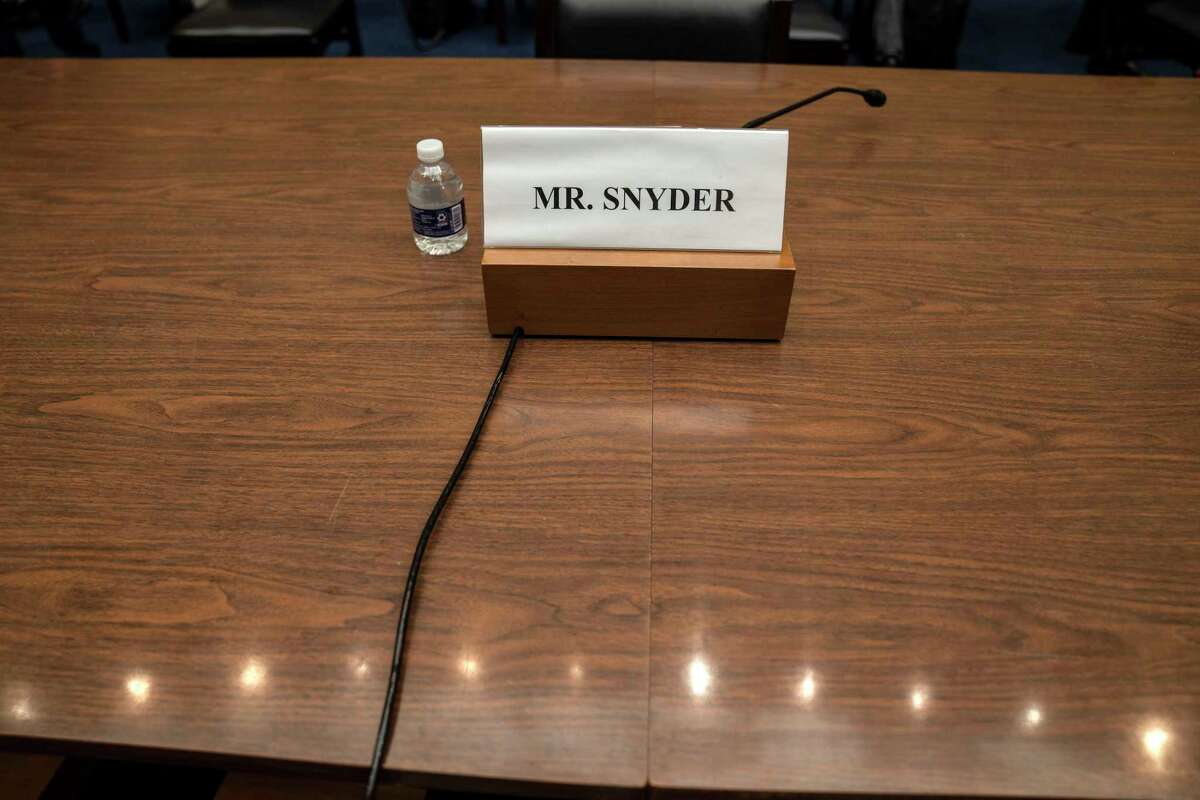 A name card for Washington Commanders owner Daniel Snyder sits at a table where the House Committee on Oversight and Reform held a hearing about the team's workplace.