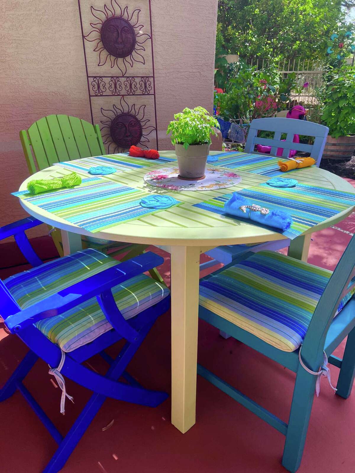 While some of the patio decor was shipped from Mexico, other pieces, like the wood dining table that Susan painted, came from no further than World Market.