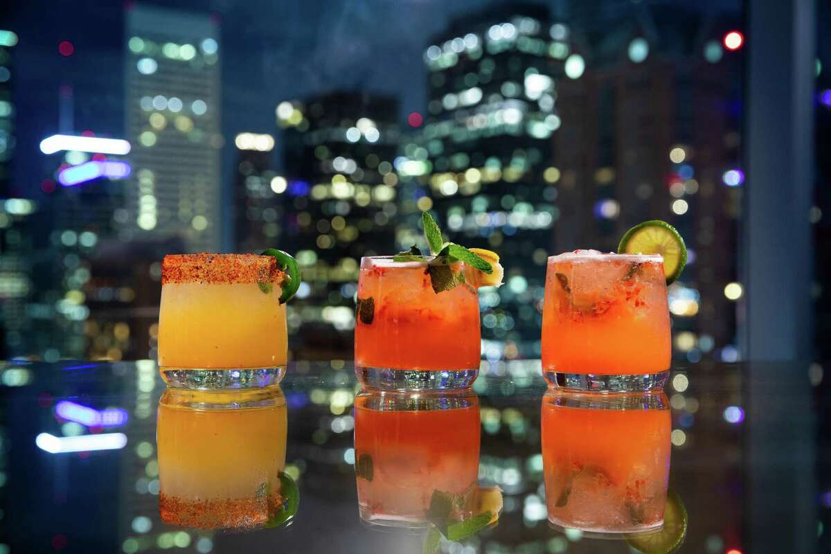 Cocktails at R24, the new top-floor bar and lounge on the 24th floor of Hilton Americas downtown.