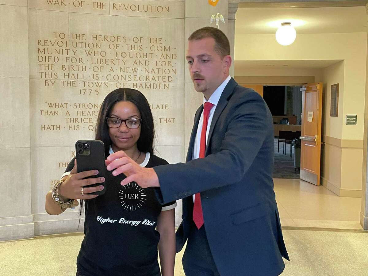 Stephanie Washington, left, and her attorney Win Smith III at Hamden Memorial Town Hall June 21, 2022.