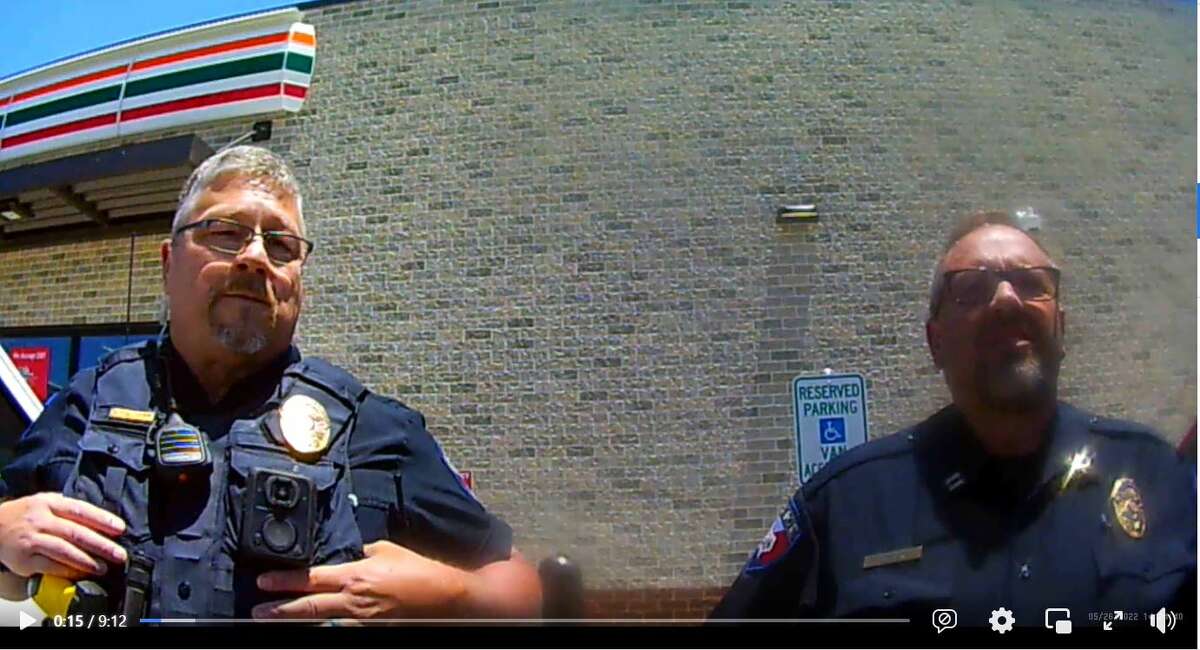 A Facebook screen grab captured from Michael McQueen's body camera footage shows two Joshua Police Department officers confronting him outside of a 7-Eleven in May.