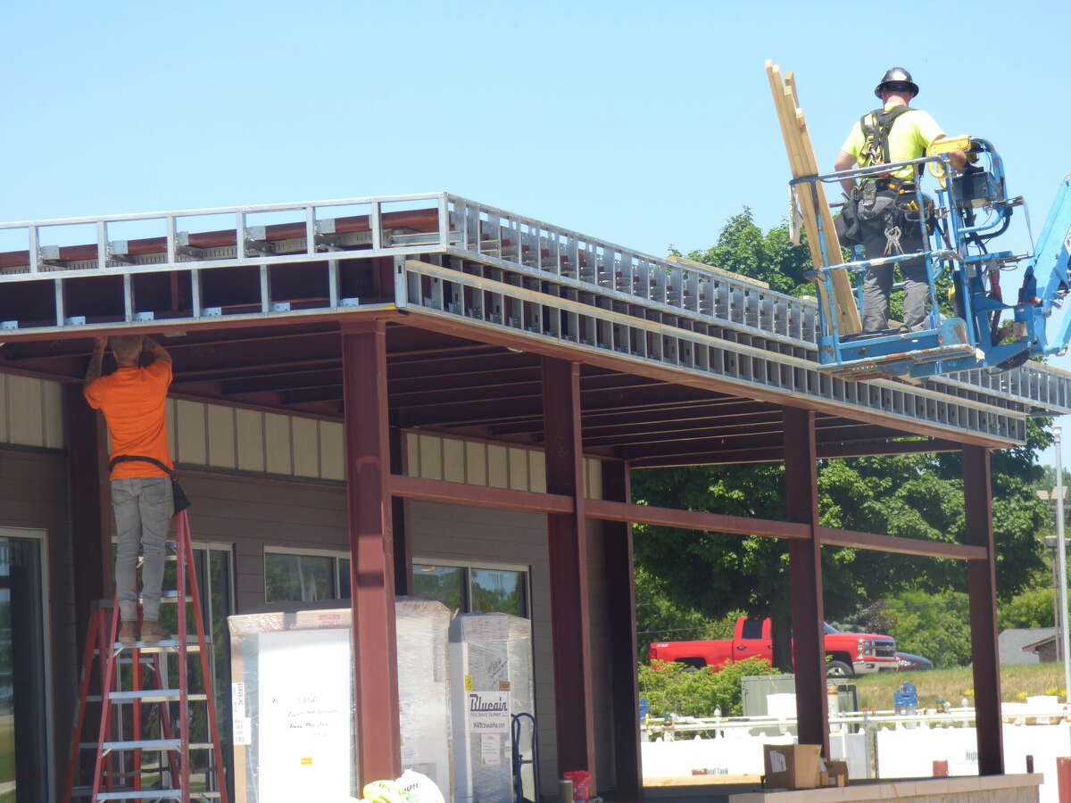 Construction workers convert the former Kmart gas station in Filer Township into a NUVU Fuels station. Work on the new convenience store is expected to be completed by July 15. 