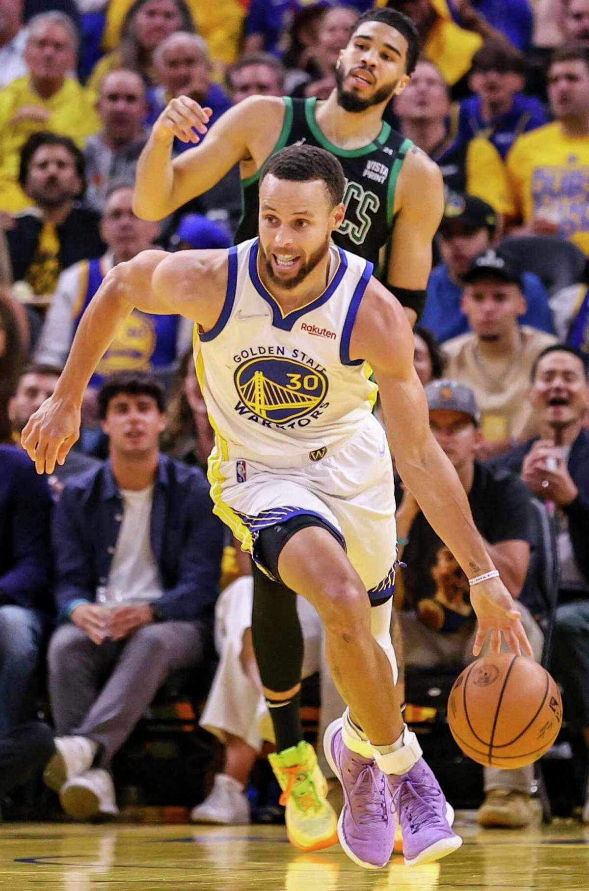 Golden State Warriors' Stephen Curry, 30, heads up court during the third quarter in Game 5 of the NBA Finals at Chase Center in San Francisco, Calif., on Monday, June 13, 2022.