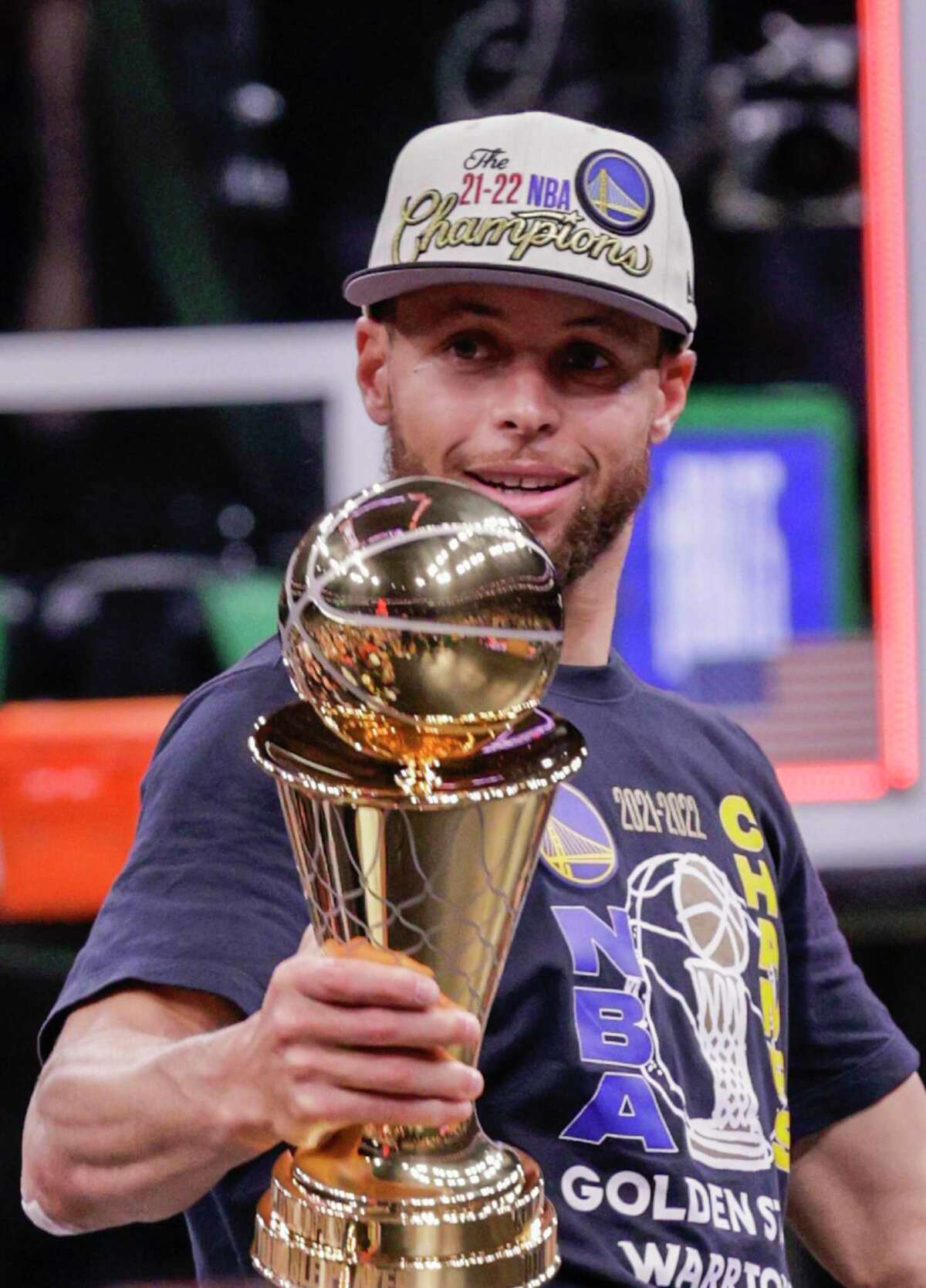 Golden State Warriors' Stephen Curry, 30, holds the Bill Russell NBA Finals Most Valuable Player Award after the Golden State Warriors defeated the Boston Celtics 103 to 90 in Game 6 to win the NBA Finals at TD Garden in Boston, Mass., on Thursday, June 16, 2022.