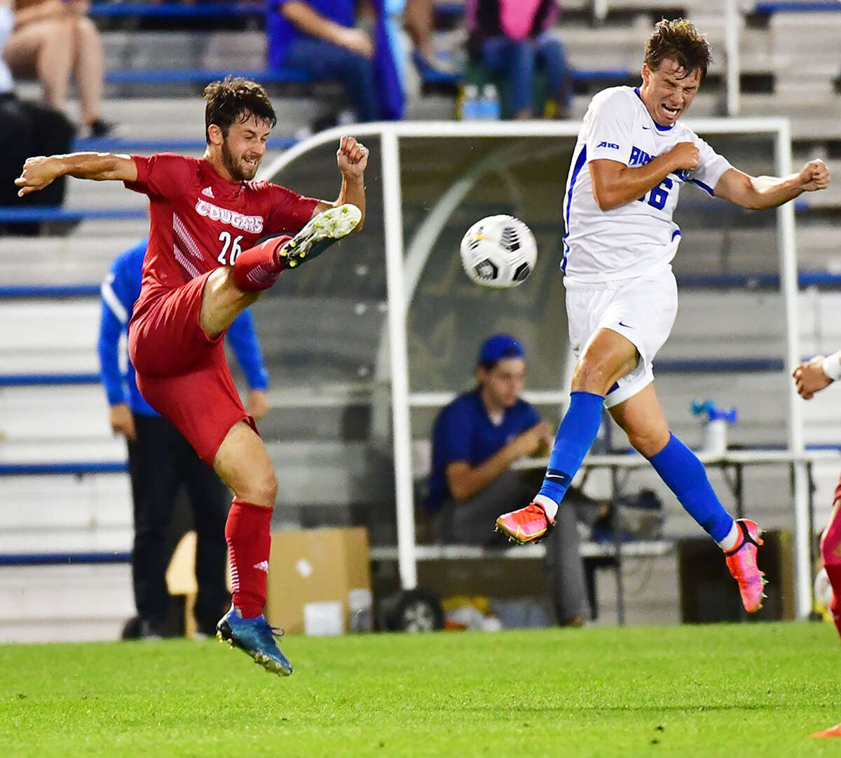 Seth Anderson of Saint Louis University, right, winces as Corban McAvinew volleys a shot during last season's Bronze Boot Game at SLU. The 2022 Bronze Boot Game will be played at SIUE on Sept. 13 at Korte Stadium.