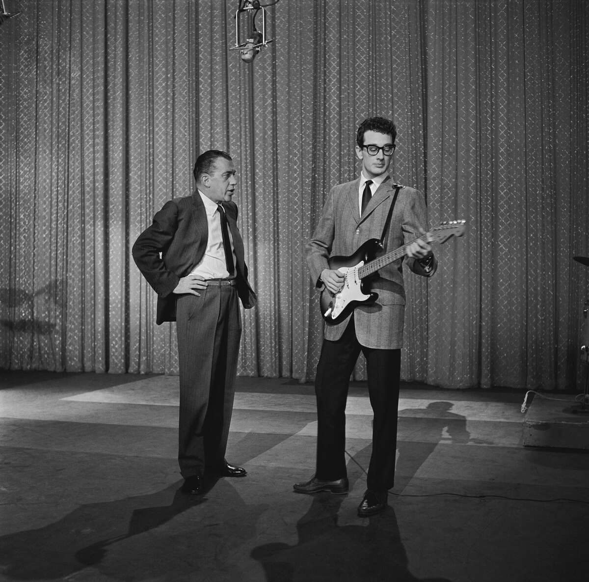 NEW YORK - JANUARY 26, Buddy Holly (Charles Hardin Holley) (with Ed Sullivan) performs on the Ed Sullivan Show at the Ed Sullivan Theatre on January 26, 1958 in New York City, New York. (Photo by Steve Oroz/Michael Ochs Archives/Getty Images)
