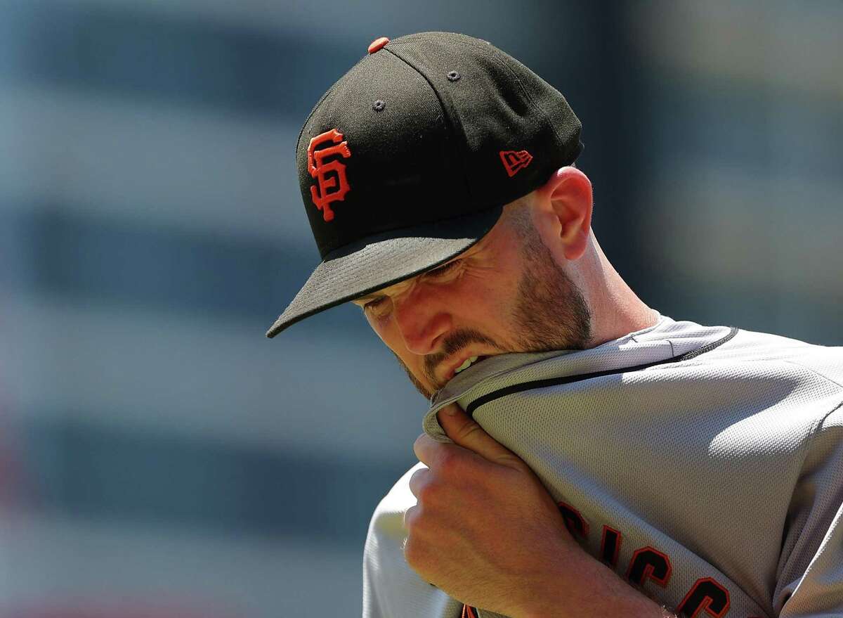 ATLANTA, GEORGIA - JUNE 23: Alex Wood #57 of the San Francisco Giants reacts after being pulled in the second inning against the Atlanta Braves at Truist Park on June 23, 2022 in Atlanta, Georgia. (Photo by Kevin C. Cox/Getty Images)
