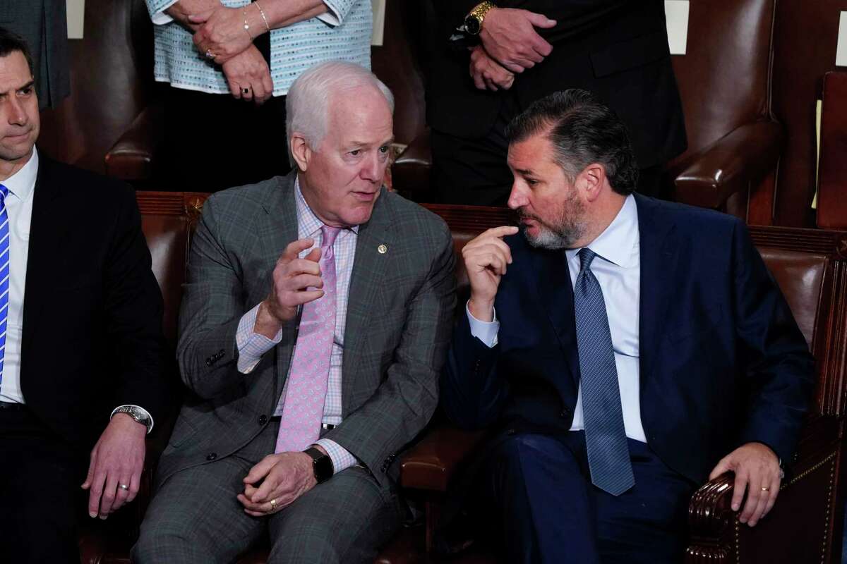 Sen. John Cornyn, R-Texas, left, and Sen. Ted Cruz, R-Texas, speak together in the House chamber as they await a speech by Greek Prime Minister Kyriakos Mitsotakis, at the Capitol in Washington, Tuesday, May 17, 2022. (AP Photo/J. Scott Applewhite)