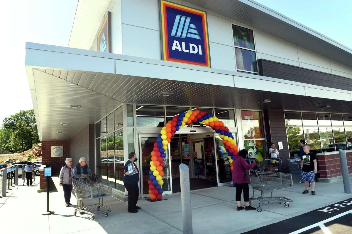 Shoppers enter the newly opened Aldi grocery store in Branford on June 23, 2022.