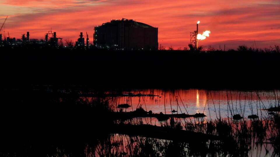 A flare burns at Venture Global LNG in Cameron, La., on Friday, April 21, 2022. The new facility, which exports liquefied natural gas, is one of several like it along the Gulf Coast — and there are proposals for several more in Louisiana and Texas.