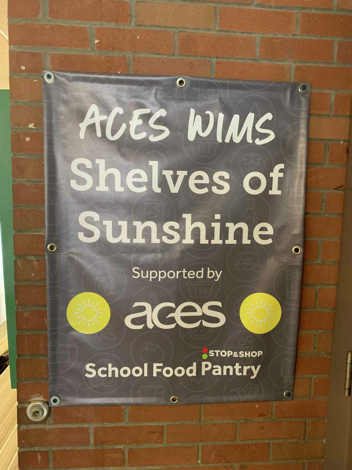 A sign for the food pantry at ACES Wintergreen Interdistrict Magnet School.