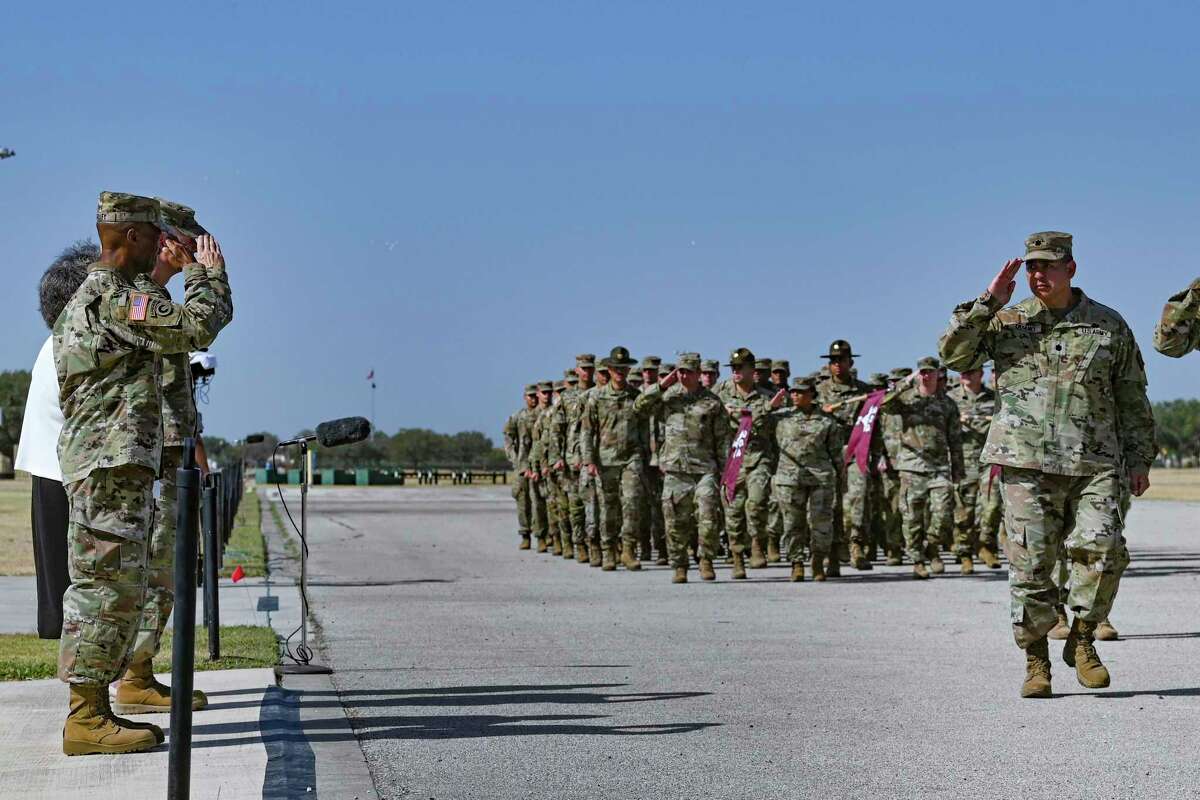 Maj. Gen. Michael J. Talley, left, salutes as units pass in review during a change of command ceremony at Ft. Sam Houston on Thursday, June 23, 2022. Talley takes over command of the U.S. Army Medical Center of Excellence from Maj. Gen. Dennis LeMaster. More than 5,000 soldiers are assigned to MEDCoE, which trains about 35,000 medical specialists a year, including all the Army’s combat medics.