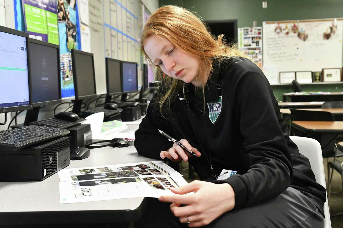 Sophomore Arleigh Doehring reads over yearbook proofs prior to sending them in for the final deadline. Doehring, who was a member of both the newspaper and yearbook staffs, was a state and national award-winning photographer this year.