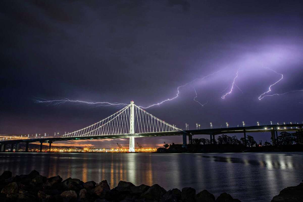 Lightning illuminates the sky over the eastern span of the Bay Bridge as a storm passed through the area on August 16, 2020. In the days following, historic lightning-sparked wildfires erupted across the Bay Area and Central Coast.